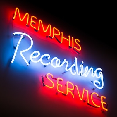 neon sign in white and red that says memphis recording service